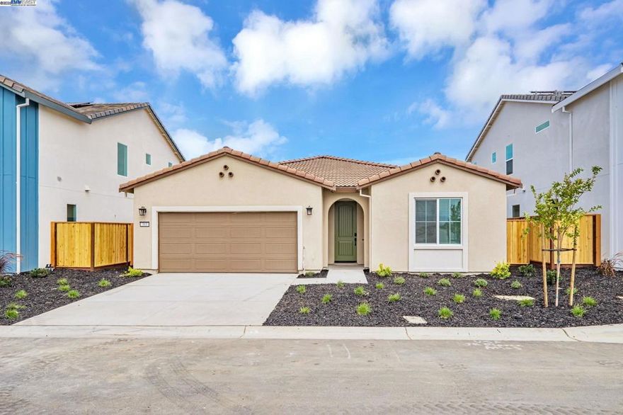 Welcome to Newport Pointe, A New Home Net ZERO ALL ELECTRIC Community by Century Communities. This is a Single Story - South Facing lot.  Plan 2 offers 2,091 square feet of living space with 3 Bedrooms, Den, 2 Full Bathrooms and 2 Car Bay Garage.  Home includes cabinets with a Espresso finish, convenience pkg, concealed hinges and chrome hardware.  The kitchen offers Granite counter tops with a 3x6” tile back splash.  Stainless Steel Kitchen KitchenAid Appliances with an Electric Range.  Appliances include Refrigerator, Washer and Dryer.  Additional Features include - Tub at Primary Bedroom, Laundry room cabinets, Blinds, Solar – Lease and Purchase options, Net Zero Energy Package which includes Energy Efficient Water Heater & Furnace and Car Charger – 40 AMP with Receptacle. Century Home Connect, 3 ¼” Base Boards, Luxury Vinyl Plank (LVP) at first floor - excludes Bedrooms. Shaw Carpet in bedrooms and closets.  Newport Point offers the perfect balance of small-town charm and resort-style living.  Residents will enjoy a wide variety of community amenities designed to elevate everyday life and create memorable experiences.