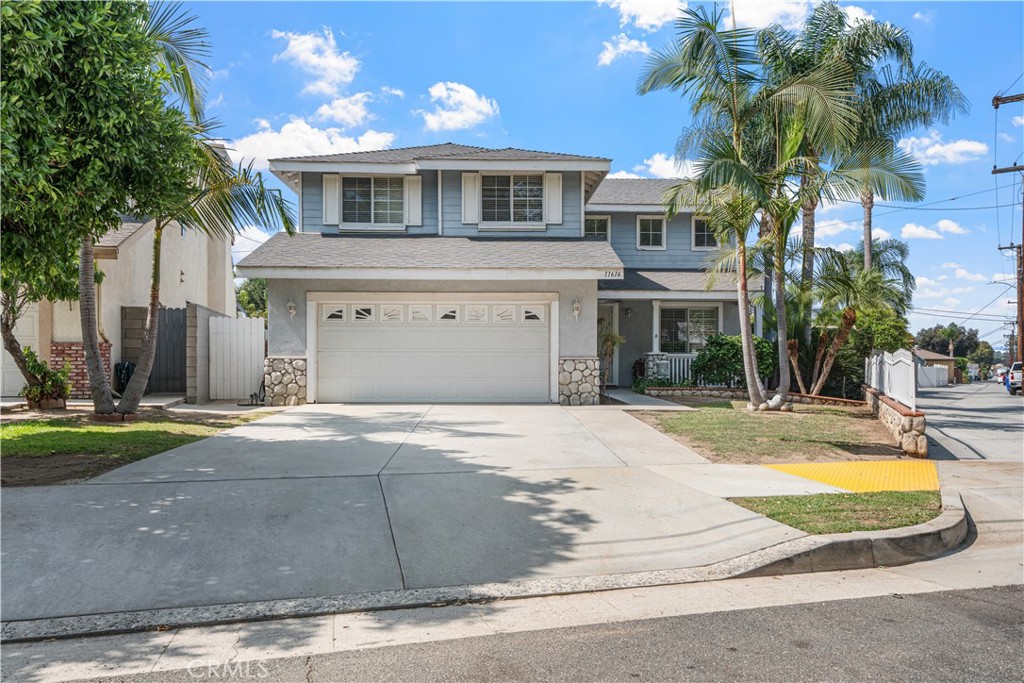 This beautiful 4-bedroom, 3-bathroom pool home sits on a generous 10,029 SF lot, offering around 2,294 sq. ft. of living space. The home combines flexibility and potential, with plenty of room to grow. The first floor features a spacious living area, dining room, a modernized kitchen with new appliances, an upgraded den, one bedroom, and a full bathroom. Upstairs, there are 3 bedrooms, 2 bathrooms, a loft, and a laundry room. Sliding doors from the updated kitchen open to an entertainer's backyard, complete with a large covered patio and a bar for gatherings. A step down leads to a basketball court and a sparkling pebble tech pool with recently updated equipment. The expansive backyard also includes RV parking and vibrant plumeria trees. Conveniently located with a park across the street, this home offers larger-than-average lots, creating a spacious neighborhood feel. With great curb appeal and proximity to parks, shopping, and dining, this home is a must-see!
