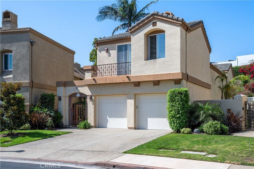 Discover this stunning West High home in the esteemed Pacific Colony neighborhood. Enter through an elegant wrought iron gate to find a peaceful tropical garden with palm trees, vibrant flowers, and a water fountain. This Mediterranean-style house features high ceilings in both the living and formal dining rooms. The modern kitchen is equipped with stainless steel appliances, corian countertops, an island, and a breakfast nook. Relax in the inviting family room or enjoy the beautiful hardwood floors, custom window shutters, and skylights throughout. The thoughtful layout includes three bedrooms upstairs and one on the main floor. The spacious master suite boasts a fireplace, dual walk-in closets, a balcony, and a Jacuzzi tub. Additional features include a separate laundry room and one of the best lots in the complex. Perfectly located within walking distance to schools, shopping, and the Redondo Beach pier.