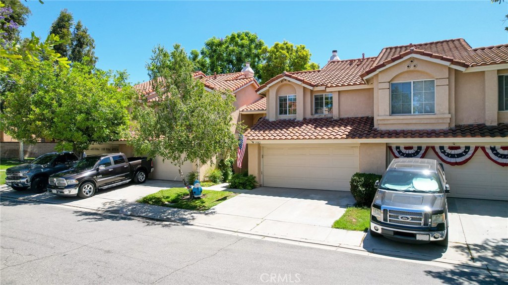 Welcome to 19082 Canyon Court in the amazing community of Portola Hills! This home is perfectly positioned featuring immense privacy, beautiful upgrades and is nestled in the quiet community of Canyon Rim. Designer floors stretch throughout the home while large windows flood in plenty of beautiful natural light. The fireplace will create a cozy feeling during the California nights and the high-pitched ceilings create a bright, open-concept space for an inviting atmosphere perfect for entertaining friends and family. The floor plan encompasses two large suites with updated ensuite bathroom as well as a ground level bathroom. The modern gourmet kitchen comes well-appointed with plenty of upgrades including stainless steel appliances and a beautiful accent wall that flows seamlessly into the dining area and private rear patio. The kitchen also has direct access to the oversized, two car garage. The primary suite is the perfect getaway space complete with a convenient walk-in closet. The spacious patio is very private featuring exquisite landscaping and a delightful space to entertain outdoors. The home is situated just minutes away from an award-winning elementary school and a newly constructed community park. With its warm sense of community and close proximity to shops and restaurants, this home provides the relaxing, comfortable and easy-going lifestyle you have been looking for.