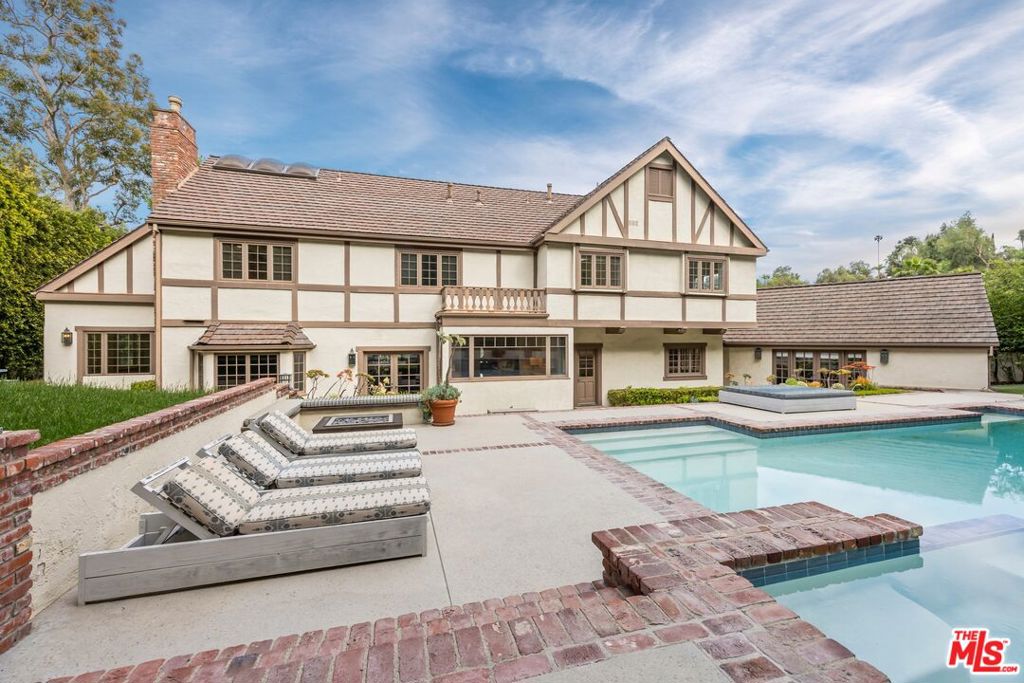 Located in the prestigious Ashley Oaks enclave and within the coveted Lanai School District, this exquisite 5-bedroom, 5-bath estate offers elevated living in prime Encino. Tucked between lush hedges on a private cul-de-sac, the home showcases timeless Tudor architecture with dramatic vaulted beam ceilings, leaded glass windows, and rich wood floors. The chef's kitchen impresses with high-end appliances, granite counters, and a stunning 12-ft picture window overlooking the grounds. Upstairs, the expansive primary suite features dual walk-in closets, a private lounge, and a spa-like marble bath. The entertainer's backyard is a true sanctuary with a resort-style pool, spa, fire pit, built-in BBQ, and sprawling lawn. A rare opportunity to own in one of Encino's most sought-after neighborhoods. PROPERTY IS AVAILABLE FOR A LEASE TERM OF UP TO ONE YEAR
