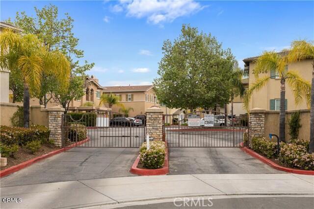 Live in Comfort and Style - Beautiful 2 Bed/2 Bath Home in the Sought-After Verona Community! Now available! This highly desirable second-floor condo in the serene Verona community offers the perfect blend of comfort, convenience, and style. Step into this spacious and freshly upgraded 890 sq ft home, featuring updated vinyl plank flooring, a modern and cozy paint palette that complements any decor. The open-concept living and dining area is highlighted by a cozy fireplace, creating a warm and inviting atmosphere. Sliding doors lead to a private balcony--your own peaceful retreat for morning coffee or evening relaxation.The kitchen is both functional and stylish, offering ample counter space, generous cabinetry, and a breakfast bar ideal for casual meals or entertaining.Down the hallway, you'll find a stackable washer/dryer tucked neatly in a closet, providing easy in-unit laundry access. The primary bedroom features a walk-in closet and a private ensuite bathroom with a newly updated vanity. The second bedroom is equally versatile--perfect for a guest room, home office, or fitness space.Enjoy the convenience of a one-car garage with remote access, offering both parking and extra storage.As a resident, you'll have access to resort-style amenities including a fully equipped fitness center, a sparkling pool and spa, and a barbecue area--all conveniently located from your condo unit.Don't miss this opportunity to live in one of the most desirable communities around. Homes like this go fast--submit your rental application today and make this lovely condo your new home!