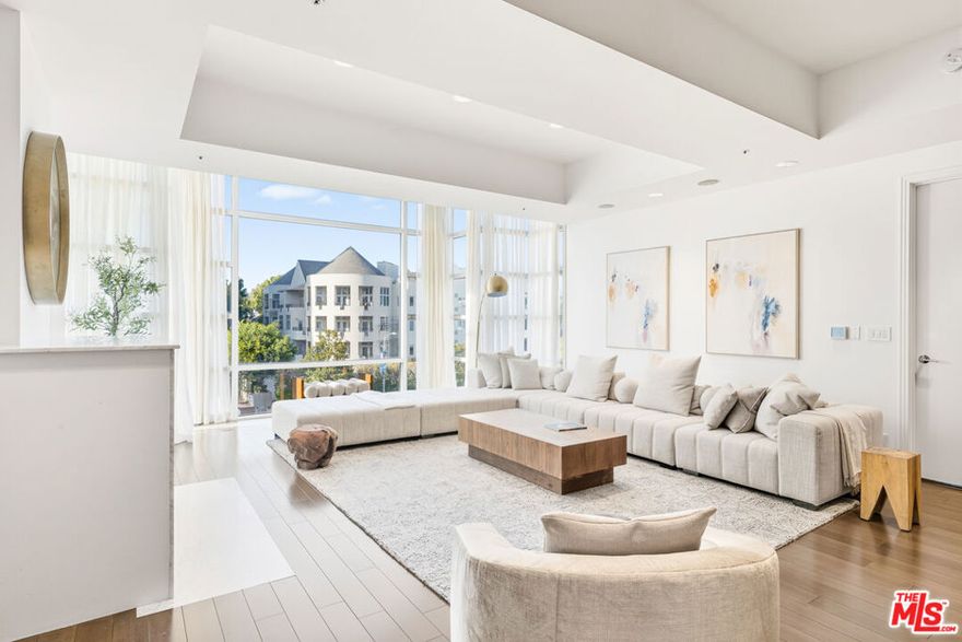 Experience refined living in this front-facing third-floor residence at La Tour, one of the Wilshire Corridor's most prestigious full-service buildings. This three-bedroom, three-and-a-half-bath residence spans over 3,000 square feet of elegant, light-filled interiors designed for both sophistication and comfort.A grand formal entry leads to expansive open living spaces featuring floor-to-ceiling glass, high ceilings, and gorgeous hardwood floors. The seamless flow includes a living room with a fireplace and electric shades, a cozy media alcove, and a spacious dining areaperfect for both entertaining and everyday living. The chef's kitchen boasts Poggenpohl cabinetry, premium stainless-steel appliances, and an adjoining breakfast area that opens to a large balcony ideal for outdoor dining. The corner primary suite offers a serene retreat with an oversized walk-in closet and a luxurious spa-inspired bath with double vanities, a steam shower, and a soaking tub. Two additional en-suite bedrooms provide comfort and privacy for guests or family.Additional highlights include a Control4 smart home system, powder room, large laundry room with sink, and private storage. Residents enjoy La Tour's renowned full-service amenities24-hour concierge, security, and valet, along with a  pool, gym, and recreation room. Whether you're seeking a full-time residence or a pied--terre for bi-coastal living, this exceptional condominium offers a rare opportunity to experience elevated living on the Wilshire Corridor.