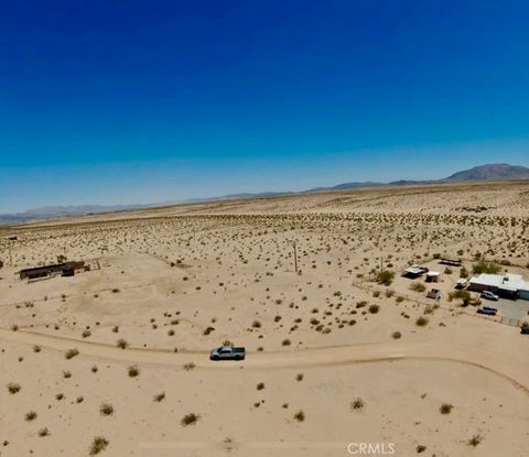 Photo of 76693 Garden Road, 29 Palms, CA 92277 (MLS # JT26081129)