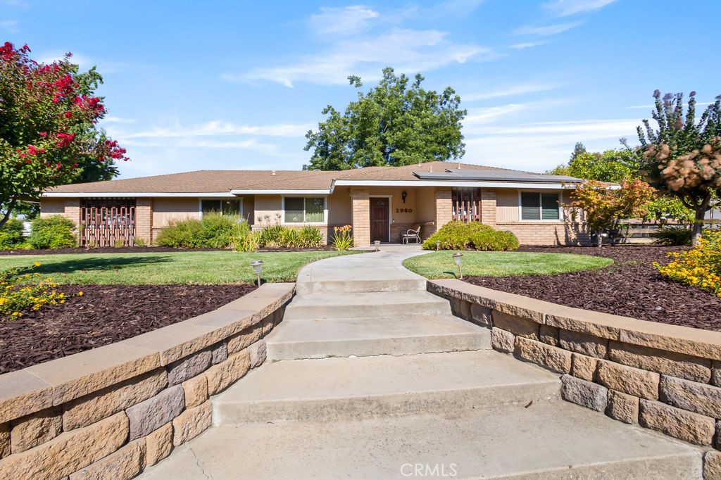 Set on a beautifully landscaped 1.1-acre lot in North Merced’s prestigious Whitegate neighborhood, this elegant estate offers privacy, natural beauty, and timeless charm. Mature fruit trees and vibrant gardens frame the home, which features formal living and dining areas, a light-filled sunroom, and a well-appointed kitchen with abundant storage and serene backyard views.
The spacious primary suite includes a sitting area, walk-in closet, and sliding doors that open to the lush grounds. Outdoors, unwind by the tranquil koi pond and waterfall, or take advantage of the detached two-room structure—ideal for a potential workshop.
Recent upgrades include a new residential well, solar, and water purification system. The home also features dual-pane windows and solar tubes to enhance natural light. Additional highlights include potential RV/boat parking, a utility room with workbench, and extensive storage throughout.
All this, just minutes from UC Merced, the new hospital, and premier shopping.