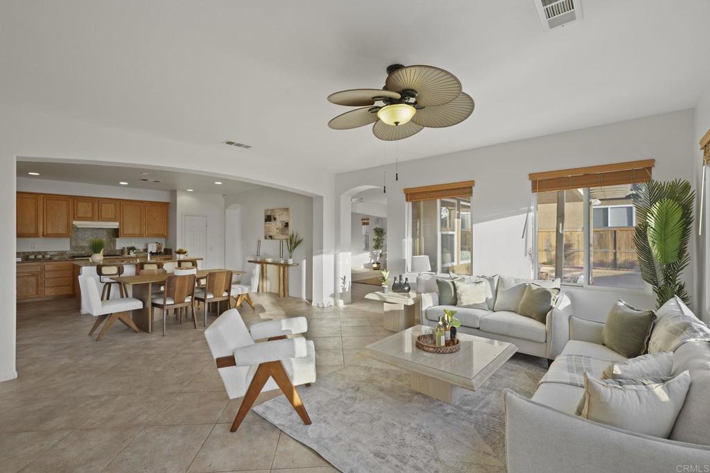 Beautifully 5BR/3BA home in the highly sought-after Otay Ranch community! This spacious residence offers an open floor plan with a gourmet kitchen featuring granite countertops, stainless steel appliances, and a large center island. The inviting living area includes a cozy fireplace, while the primary suite boasts a walk-in closet and spa-inspired bath. A downstairs bedroom and full bath are perfect for guests or multi-generational living. Enjoy the private backyard with a covered patio and a pool. Conveniently located near top-rated schools, parks, shopping, dining, and easy freeway access.