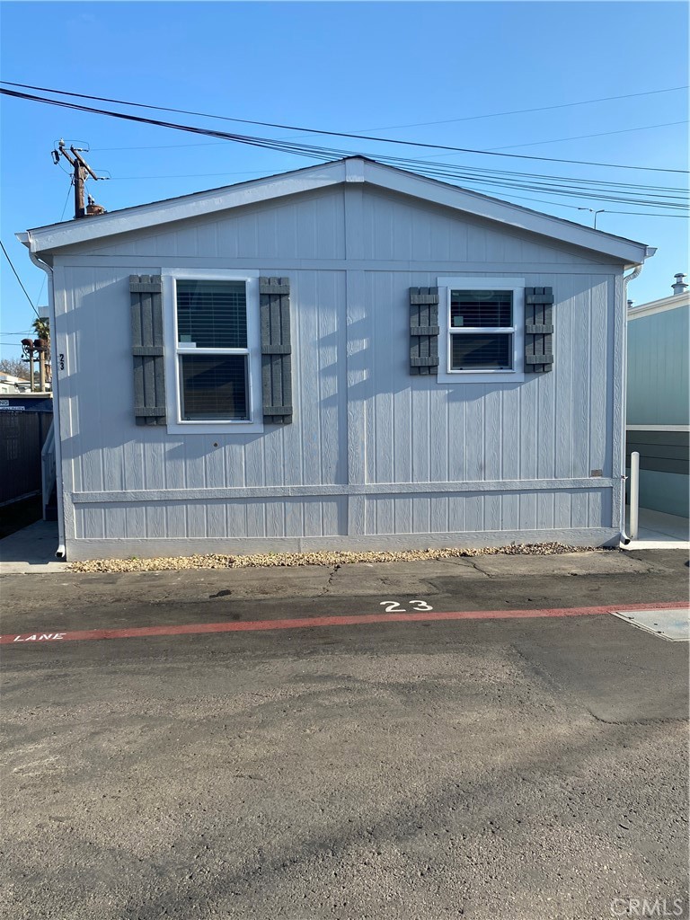This newly refreshed manufactured home features 2 bedrooms and 2 bathrooms. Upgraded kitchen packages includes: hardwood cabinets with shaker style doors, adjustable shelving, and soft-close, hidden hinges. Stainless steel appliance package includes: 21 CF SxS refrigerator with ice/water, self-cleaning gas range, microwave over range, and garbage disposal. Counters are granite w/ 6" granite backsplash, and granite behind the range, with square edges. Bathroom counters are also granite w/ 6" granite backsplash. Master bath and guest bath includes tub/shower and rectangular, undermount sinks. A separate utility room features storage cabinetry and washer/dryer hookups. Recessed canned lighting throughout, 2' faux wood blinds, and more.