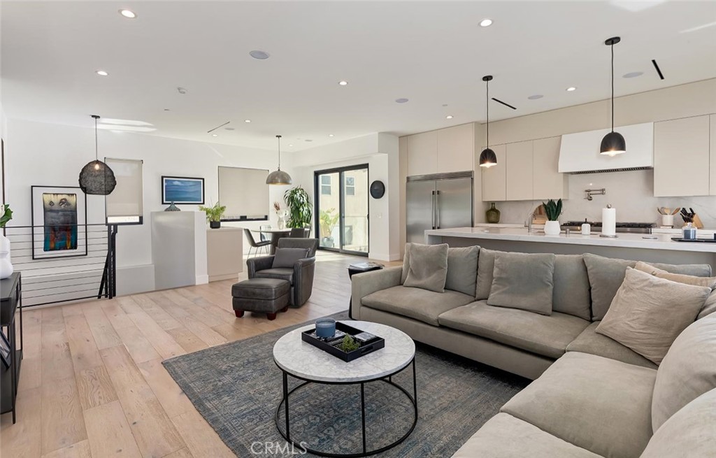 Welcome to 622 1st Place, a sleek, contemporary quiet and detached rear townhome situated in one of most sought-after neighborhoods in Hermosa Beach. Built in 2022 and exceptionally maintained, this like-new residence offers a modern coastal lifestyle just moments from the beach, The Strand, and the lively energy of Pier Avenue — while enjoying the tranquility of a quiet, rear-unit location.
Spanning four bedrooms and three and half bathrooms across three beautifully designed levels, the home effortlessly balances functionality with sophisticated style. The heart of the home is an open-concept living space with wide-plank wood flooring, abundant natural light, and a seamless connection to a private balcony — perfect for relaxed mornings or evening gatherings. The chef’s kitchen is a showstopper, featuring top-tier stainless appliances, custom cabinetry, and a sleek island ideal for casual dining or entertaining.
A private in-home elevator services all levels, adding everyday convenience for moving between floors — whether transporting groceries, luggage, or guests. The four spacious bedrooms include a luxurious primary suite with a custom walk-in closet and a spa-inspired en suite bath, complete with dual vanities, a freestanding soaking tub, and an oversized walk-in shower. Secondary bedrooms are generously sized and versatile, ideal for guest rooms, a home office, or a gym.
Crowning the home is an expansive rooftop entertaining deck with sweeping ocean views, offering a perfect setting for sunset dinners, weekend lounging, or festive gatherings under the stars. An extra-large garage provides ample space for multiple vehicles, storage, and beach gear or even entertaining— a prized amenity in this beachside community.
Set in a friendly, walkable enclave of Hermosa Beach, residents enjoy easy access to award-winning schools, scenic coastal bike paths, and some of the South Bay’s best dining, coffee shops, and boutique fitness studios. With its blend of modern design, thoughtful amenities, and a prime location just a short stroll from the sand, 622 1st Place captures the essence of elevated Southern California beach living.