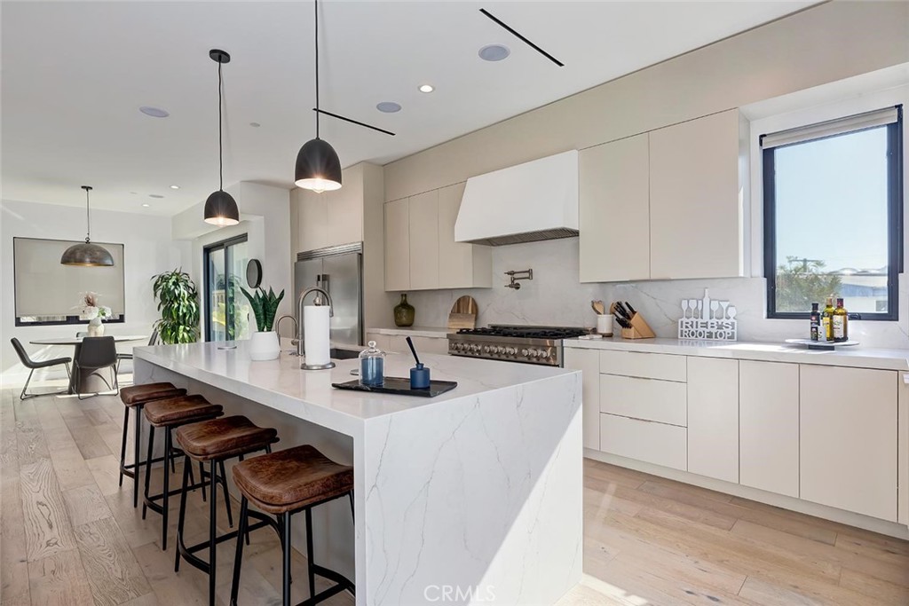 Welcome to 622 1st Place, a sleek, contemporary quiet and detached rear townhome situated in one of most sought-after neighborhoods in Hermosa Beach. Built in 2022 and exceptionally maintained, this like-new residence offers a modern coastal lifestyle just moments from the beach, The Strand, and the lively energy of Pier Avenue — while enjoying the tranquility of a quiet, rear-unit location.
Spanning four bedrooms and three and half bathrooms across three beautifully designed levels, the home effortlessly balances functionality with sophisticated style. The heart of the home is an open-concept living space with wide-plank wood flooring, abundant natural light, and a seamless connection to a private balcony — perfect for relaxed mornings or evening gatherings. The chef’s kitchen is a showstopper, featuring top-tier stainless appliances, custom cabinetry, and a sleek island ideal for casual dining or entertaining.
A private in-home elevator services all levels, adding everyday convenience for moving between floors — whether transporting groceries, luggage, or guests. The four spacious bedrooms include a luxurious primary suite with a custom walk-in closet and a spa-inspired en suite bath, complete with dual vanities, a freestanding soaking tub, and an oversized walk-in shower. Secondary bedrooms are generously sized and versatile, ideal for guest rooms, a home office, or a gym.
Crowning the home is an expansive rooftop entertaining deck with sweeping ocean views, offering a perfect setting for sunset dinners, weekend lounging, or festive gatherings under the stars. An extra-large garage provides ample space for multiple vehicles, storage, and beach gear or even entertaining— a prized amenity in this beachside community.
Set in a friendly, walkable enclave of Hermosa Beach, residents enjoy easy access to award-winning schools, scenic coastal bike paths, and some of the South Bay’s best dining, coffee shops, and boutique fitness studios. With its blend of modern design, thoughtful amenities, and a prime location just a short stroll from the sand, 622 1st Place captures the essence of elevated Southern California beach living.
