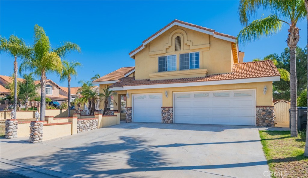 Welcome to the beautiful 4 bedrooms, 3 bathrooms property located in a quiet and friendly neighborhood. It boasts many upgrades: Style Vinyl Plank Floorings; Modern appeal of quartz countertops; Fresh interior paint. This turnkey home features a bright and open floor plan. Upon entry, you will notice sprawl high ceilings in the living room connected with the formal dining area. The kitchen seamlessly opens to a cozy family room enhanced by a gas fireplace. Creating flexible space for everyday living. A delicate laundry room, 1 bedroom & 1 bathroom are on the main level. Private and spacious backyard featuring multi-layer brick flower planters. To plant a variety of flowers, trees create a charming, permanent and organized garden space. Large and wide staircases lead you to the upper level where you will find a primary suite, 2 bedrooms and 1 guest bathroom. The master suite with a stand-up shower and a separate soaking tub provides both the functionality of a shower and relaxation of a deep bath; Double vanity configuration offers more counter space; A large walk-in closet features extensive storage options. A custom-designed front yard with palm trees surround significantly adds to a charm and great curb appeal of the house. An exclusive, designated area for RV or boat parking is a highly desirable feature for the property. A 3-car garage provides ample space for parking and storage. Live here to discover the perfect blend of convenience. Close to parks; schools; restaurants; banks; shopping malls; Costco; WinCo Foods. Easy access to 215/60 Fwy. About 6 miles from UCR. It's a rare opportunity to locate a house with a low tax rate and no HOA fees. This is your perfect dream home!
