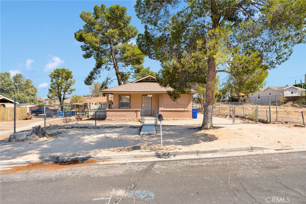 * WELCOME HOME! * This 2 bed 1 bath home sits on a nice size lot that is fully fenced with double gates giving you room for trailer parking! The covered patio out front is a perfect spot to relax after a day of work. Entering the home you will love the wood flooring and designated spaces giving you plenty of room for the whole family. With a formal living room, dining room and kitchen. Laundry hook ups are inside as well. The backyard is spacious and a blank slate for you to create the backyard oasis of your dreams!