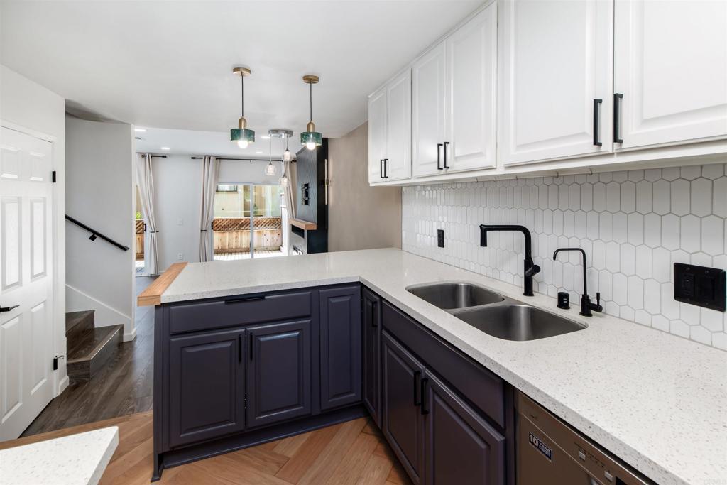 Step inside this beautifully upgraded 2-bedroom, 2.5-bath condo in the La Costa community and feel right at home. From the moment you open the front door, you’re greeted by custom built-ins, a convenient stackable washer/dryer, and a fully renovated powder room. Continue inside to the heart of the home where a renovated kitchen with sleek cabinetry, upgraded lighting, and stainless steel appliances flows seamlessly into the theater-style living room with an elegant electric fireplace—a perfect space for entertaining or relaxing. Retreat to your private spaces, where both bedrooms offer remodeled en suite bathrooms and thoughtfully designed closets. The primary suite is a true haven, complete with two spacious closets and a private deck—an ideal spot to enjoy your morning coffee or evening glass of wine. Outdoor living continues downstairs with a patio retreat outfitted with built-in cabinets, shelving, and a mini fridge, perfect for entertaining friends or relaxing in style. Additional highlights include two secure assigned parking spaces and stylish upgrades throughout. Casa Grande residents enjoy a sparkling pool and spa, plus an unbeatable location near world-class La Costa golf courses, shopping, dining, and the beach. Upgraded. Comfortable. Coastal. This isn’t just a condo—it’s the La Costa lifestyle.