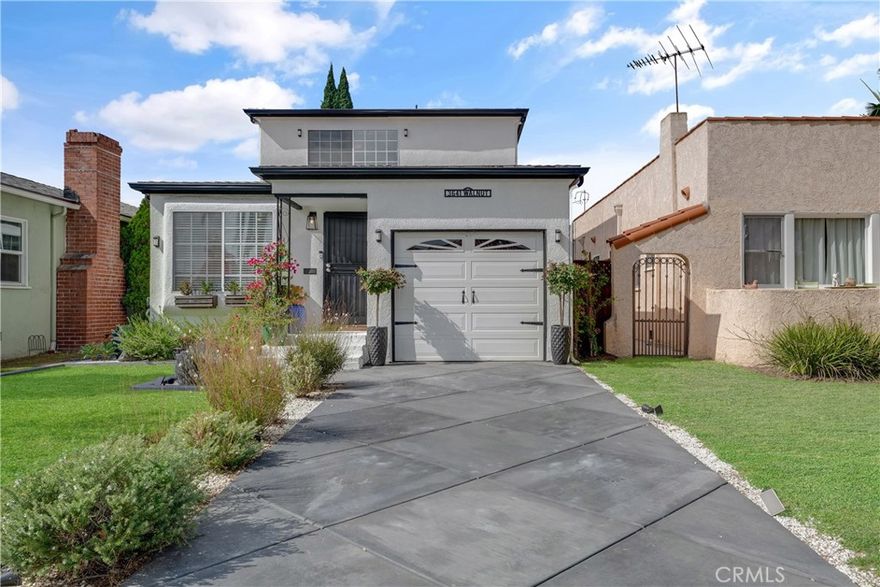 Welcome to this beautifully maintained 3 bed, 3 bath home located in the sought-after California Heights Historic District. This 2 story residence blends classic charm with modern comfort. Step inside to find a bright and inviting layout featuring a comfortable living area with a large window overlooking the front yard. The adjacent dining room flows into the well-equipped kitchen, complete with upgraded marble backsplash, stainless steel appliances and ample cabinet space. With direct access to the backyard, this layout creates the perfect set up for indoor/outdoor entertaining. The main level includes 2 generously sized bedrooms, one of which can serve as a primary suite with ensuite bathroom. The hall bath incudes a shower, and has been tastefully upgraded with Italian Carrara marble flooring, shower tiles and countertops with stylish finishes. Upstairs you will find a flexible loft-style space ideal for a home office, or media room. The second level primary suite offers a peaceful retreat with a walk-in closet and ensuite bathroom featuring dual sinks, a separate tub and shower. Additional highlights include 2 separate garages. One at the front of the home, and another at the back of the home with alley access. Recent upgrades include the front driveway, grass area with landscaping, sprinklers and a drip system. The backyard patio and bar area have been tiled, and the space includes a pergola, and above ground hot tub. Back garage has been finished with drywall/paint, crown moulding and French Doors. Laundry located just inside of the front garage. Enjoy LB living in this welcoming neighborhood in close proximity to local shops, dining, parks and more!