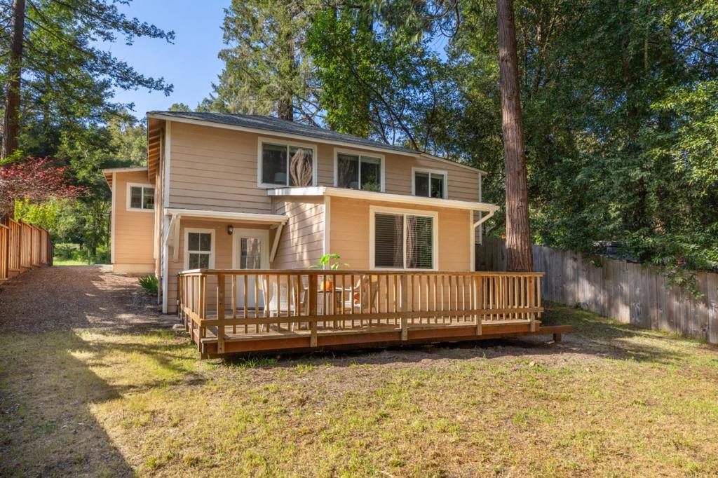 Fantastic opportunity in the heart of Boulder Creek! This duplex offers two separate units just a short stroll from downtown shops, cafes, and restaurants. Each unit provides comfortable living with its own unique charm, ideal for an owner occupant looking for rental income, multi-generational living, or a smart investment property. The front unit features 2 bedrooms and 1 bathroom, highlighted by a beautiful fireplace that creates a warm and inviting centerpiece for the living room. The back unit is a 2-bedroom, 1-bath with its own private patio overlooking a fairy ring of redwoods. Surrounded by trees, it has a peaceful sense of privacy and makes a great option for extended family, guests, or tenants. Behind the wooden fence, you'll find generous off-street parking, a rare bonus in town. With its convenient location, versatile layout, and easy access to all that Boulder Creek has to offer, this property is full of potential for both investors and homeowners alike. Just 30 minutes to the beaches of Santa Cruz and with easy access to Silicon Valley, you'll love the balance of small town mountain living and nearby city amenities.