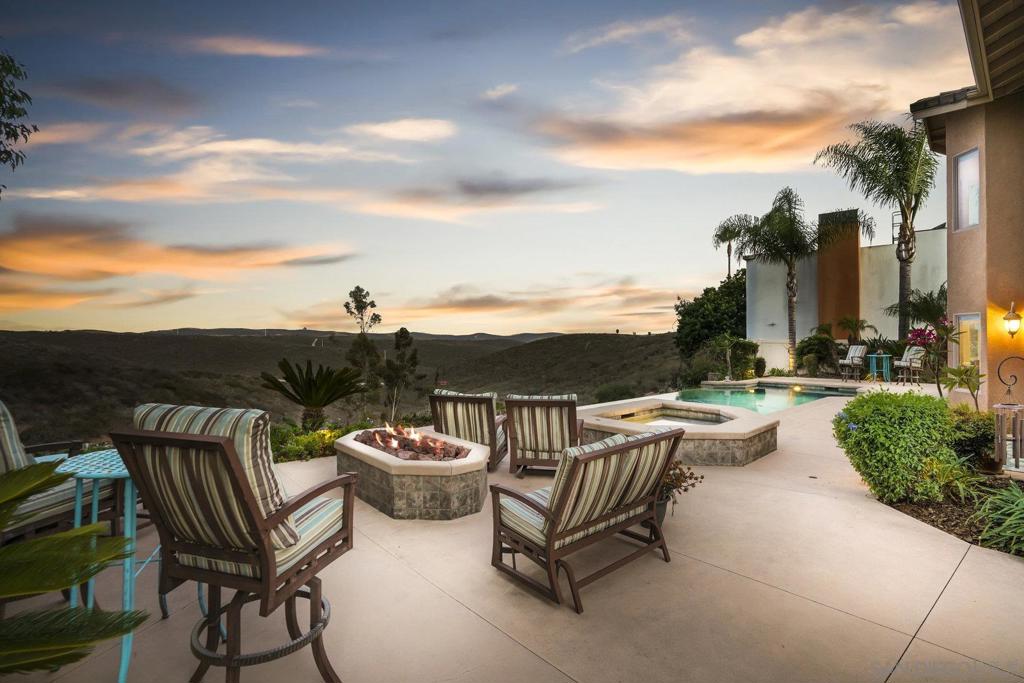 ASKING: $1,999,999 - $2,399,999. Experience the epitome of elegance and charm at 10647 Birch Bluff Ave, San Diego, CA 92131. Nestled in the esteemed neighborhood of Northridge Estates (South of Pomerado), this Italian-inspired custom home is a perfect fusion of luxury and comfort. This captivating property spans over a generous 2,655 square feet on a sprawling 27,878 sf lot. It accommodates four bedrooms and three bathrooms with an asking price ranging from $1,999,999 to $2,399,999. This custom floorplan offers a full bedroom and bathroom on the first floor (great for short or long-term guests). As you step into this architectural masterpiece, be prepared to be awestruck by imported Italian fixtures that adorn its interiors. The welcoming sight of an Infinity edge saltwater pool perfectly positioned to showcase breathtaking 180-degree unobstructed views will leave you mesmerized. The custom pool and spa includes solar heating, a new gas heater, and an upgraded control panel allowing for remote access (after you leave the restaurant, access your custom pool "APP" and remotely turn on your spa jets, heat, and lights, and everything will be ready upon your arrival). The home boasts numerous upgrades including a 25-year external stucco finish, upgraded windows throughout for better insulation and light penetration, upgraded HVAC units for optimal temperature control along with three strategically placed skylights that infuse natural lighting beautifully into the home. In addition, enjoy (33) fully paid solar panels that produce enough energy to eliminate your electric bill. The interior design showcases custom wood built-ins throughout the house providing ample storage space. Granite counters, custom cabinetry, and real wood flooring further enhance the allure of this home. An impressive chef's kitchen complete with stainless appliances, a walk-in pantry, and stunning views of the pool and natural hilltops make cooking a delightful experience. Recessed lighting, surround sound speakers (inside and out), upstairs laundry chute (drop your dirty clothes directly down to your private laundry room), grass side yard/dog run, fully finished garage (with built-ins), fully wired for security system, extended cement driveway for additional storage (BOAT/SMALL RV), fire suppression system throughout the home, large built-in safe, and a basketball court are just a few more of the many upgrades offered. Scripps Ranch offers a vibrant culture and pleasant climate. Residents can enjoy world-class dining options, shopping centers, recreational parks, Lake Miramar, and walking trails, all coupled with easy access to highways 15 and 67 for convenience. The tranquility of the Northridge Estates neighborhood combined with nearby shops, restaurants, and award winning schools create an ideal living environment. This home represents a unique opportunity to live in style in one of San Diego's most sought-after neighborhoods while enjoying all that this dynamic city has to offer. This property has NO HOA DUES or MELLO-ROOS!!!