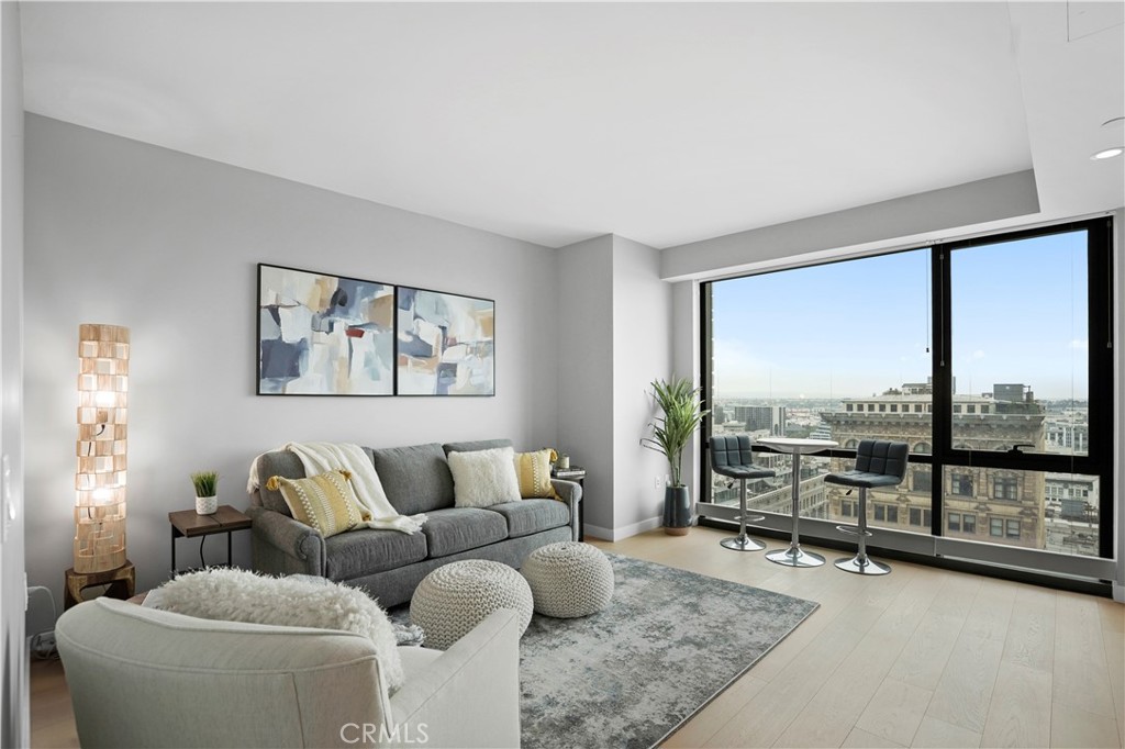 Introducing Residence 1702 at 400 S. Broadway, a beautifully appointed, light-filled studio in Perla on Broadway, Downtown LA’s premier luxury tower. Framed by sweeping skyline views through floor-to-ceiling windows, this elevated space features wide-plank European white oak flooring, high ceilings, a premium in-unit Bosch washer and dryer, and a dedicated underground parking space. The streamlined kitchen is outfitted with high-performance Italian Bertazzoni appliances, quartz countertops, and custom cabinetry for a refined, modern aesthetic.
All of this comes with an incredibly low $500 monthly HOA, which includes parking and access to Perla’s resort-style amenities.
Residents enjoy over 49,000 square feet of thoughtfully curated spaces designed for dynamic urban living. Features include private building access with 24-hour security and concierge, a rooftop pool and spa with panoramic views, a fully equipped fitness center, a screening room, conference rooms, BBQ terraces, fire pits, a clubhouse with a wine tasting room, a dog park, pet spa, and EV charging stations—everything needed to balance productivity, relaxation, and lifestyle. Whether you're working remotely or unwinding after a long day, Perla offers a rare sense of peace and tranquility in the heart of the city.
Located just one block from Pershing Square, Perla sits in the heart of the Historic Broadway Theater District and is steps from the Bradbury Building, Angels Flight, Grand Central Market, and some of LA’s most iconic dining and cultural destinations. It also borders the upcoming UCLA extension campus—ideal for students, professionals, creatives, and executives alike.
With a Walk Score of 97 and Transit Score of 100, this is authentic city living. Whether used as a weekday retreat, creative office, investment property, or pied-à-terre, Residence 1702 offers unmatched value, flexibility, and location in one of Downtown LA’s most exciting and fast-evolving neighborhoods.