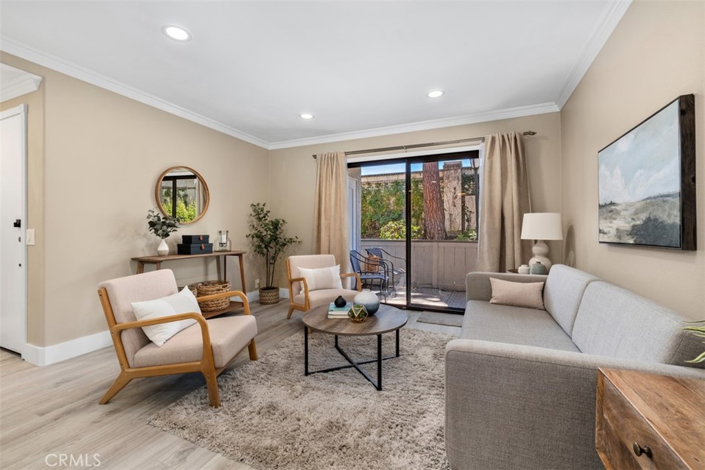 Convenient community in Laguna Niguel with resort-style amenities. Discover comfortable living in this delightful 2 bed/2 bath single-level condominium nestled in the sought after Casa La Paz community. This home offers the perfect blend of privacy, convenience, and a recreational lifestyle. Step inside to find plenty of natural light and an open-concept layout where living areas flow seamlessly. The updated kitchen features maple cabinetry, granite countertops, and stainless steel appliances. Updated crown molding and modern baseboards add beautiful touches throughout. This property includes one carport with additional storage cabinets and plenty of guest parking. In-unit washer and dryer, well appointed bedroom closets with updated built-ins. Residents enjoy exclusive access to amenities including a sparkling pool, spa, tennis courts, and a dog park. This gated community setting provides both security and comfort, and is steps from shopping, dining and entertainment. Experience California coastal living and the Casa La Paz lifestyle for yourself.