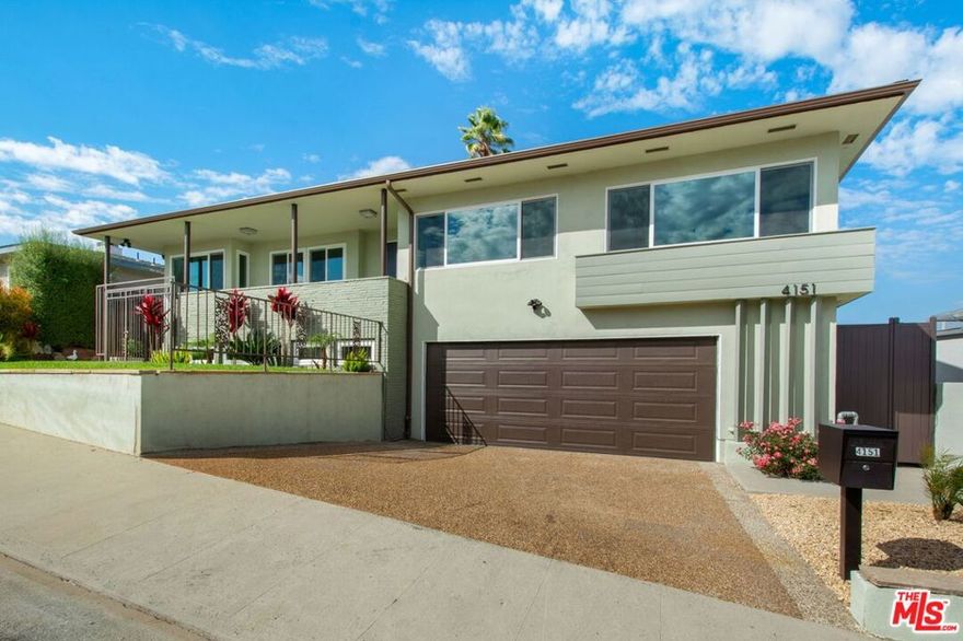Experience rare elegance and versatility in this extraordinary hillside residence, offering breathtaking panoramic views from downtown to the Hollywood Hills. Fully remodeled with refined design and superior functionality, the home features seven bedrooms, six baths, and two complete kitchens across two spacious levels each with the flexibility to function as a full residence or connected retreat. The main level showcases a light-filled living room with sweeping city views, a formal dining room, and a gourmet kitchen with an eight-foot dining island, custom cabinetry, and top-tier stainless-steel appliances. Downstairs, a second great room with its own kitchen and laundry area provides exceptional adaptability for multi-generational living, creative pursuits, or home office configurations.  Enjoy indoor-outdoor living at its best with a large, paved terrace overlooking a sparkling pool and expansive deck perfect for entertaining or quiet relaxation. Several bedrooms offer convertible potential for offices, studios, or wellness spaces.  Virtually staged for inspiration; offered unfurnished. Written lease criteria include verification of income, credit, and references. No short-term rentals permitted. Contact the listing agent for details.