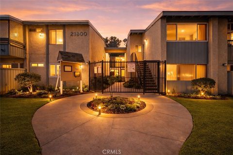 Photo of 21800 Schoenborn Street #215, Canoga Park, CA 91304 (MLS # SR26068057)