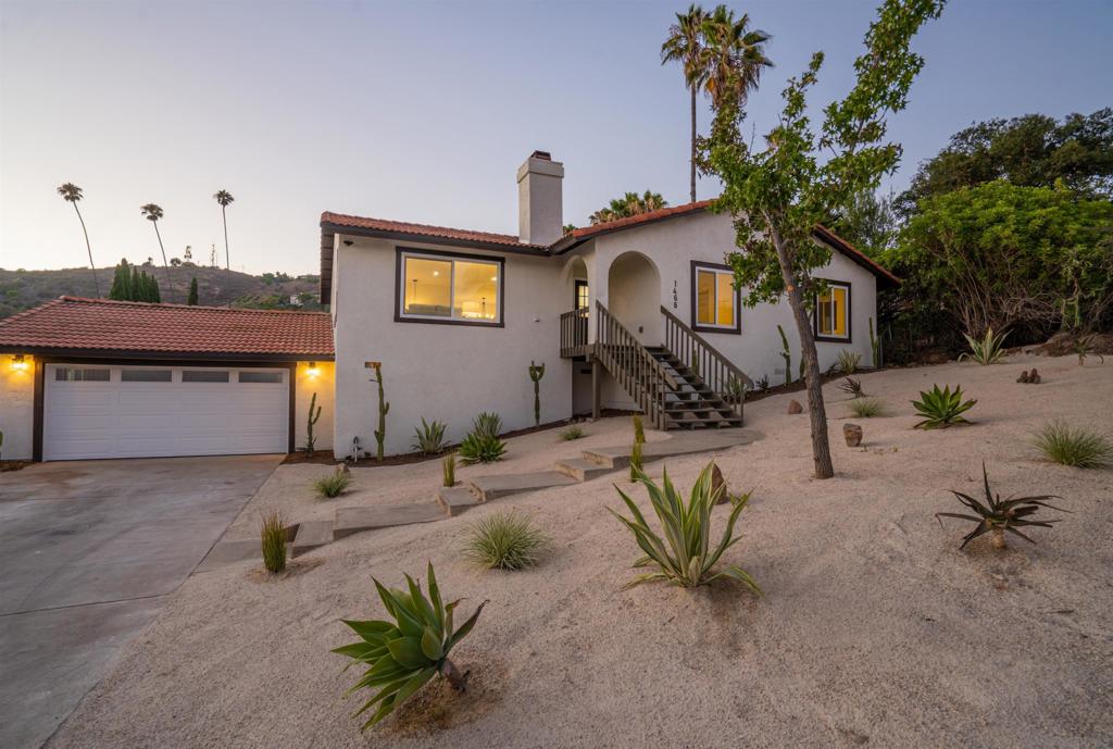?Welcome to Your Modern Retreat in North Escondido! Don’t miss this rare opportunity to own a beautifully redesigned, single-level home nestled in the hills of North Escondido. Sitting on an elevated, private lot with panoramic views and clean desert-style landscaping, this fully remodeled gem offers both tranquility and striking curb appeal.? Step inside to discover a bright, open floor plan filled with natural light, LED recessed lighting, and luxury vinyl plank flooring throughout. The spacious living room centers around a sleek quartz-tiled fireplace. It flows seamlessly into the dining area and show-stopping kitchen, complete with quartz countertops, white shaker cabinetry, stainless steel appliances, designer tile backsplash, and matte black fixtures.? Enjoy four generously sized bedrooms, including a stunning primary suite with a custom spa-style bathroom featuring marble-patterned tile, a frameless glass shower, and dual vanities. The secondary bathroom has also been thoughtfully updated with premium finishes and dual sinks.? Step outside to your private backyard oasis, featuring a concrete patio, lush grassy area, and an upper balcony perfect for entertaining or relaxing, with breathtaking sunset views.? Additional upgrades include a brand-new HVAC system with floor-level vents for optimal airflow, dual-pane windows, upgraded lighting and chandeliers, contemporary ceiling fans, and an attached two-car garage.? Located in a quiet neighborhood just minutes from shopping, dining, and freeway access, this move-in-ready home checks every box.