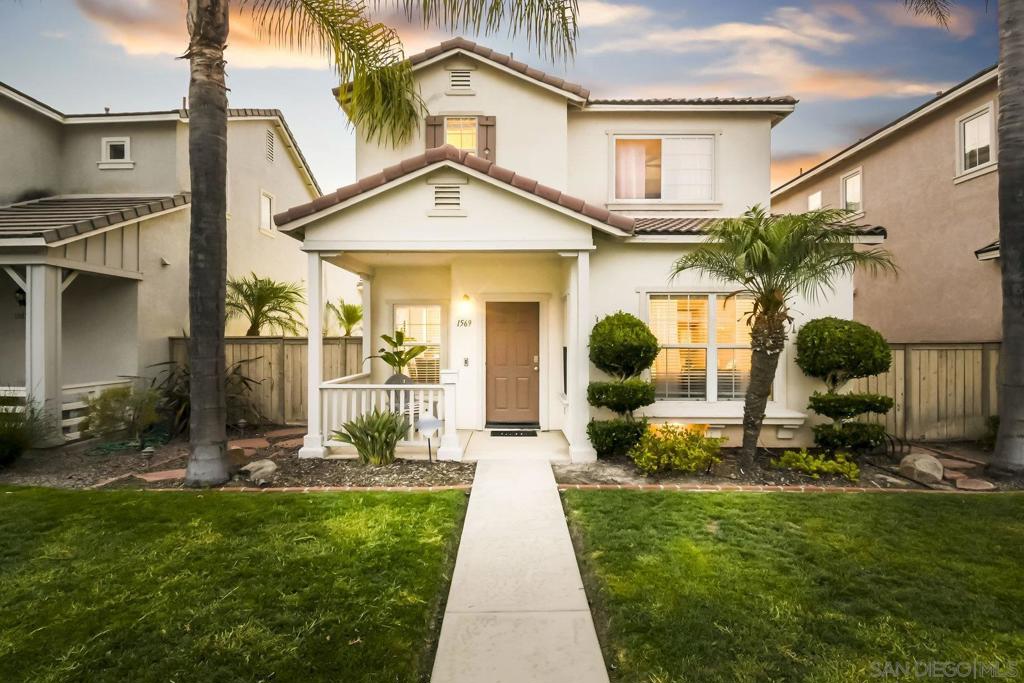 Discover this elegant 3-bedroom, 2.5-bathroom, two-story residence in the sought-after Otay Ranch community of Chula Vista. Step through the inviting front porch into a modern open-concept layout, featuring high ceilings, rich hardwood flooring, and a sleek built-in entertainment center. The kitchen impresses with a stylish breakfast bar, polished granite countertops, premium stainless steel appliances, sophisticated cabinetry, and contemporary tile flooring. The primary suite offers a spacious retreat with generous closet space, dual vanities in the luxurious en-suite bathroom, a deep soaking tub, and a sleek walk-in shower. This home blends modern comfort with timeless elegance for modern living.