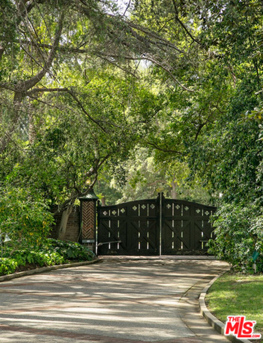 First time available in generations. #2 Oakmont is the Crown Jewel of Brentwood Park. 2.77 acres of lush grounds on the most prime street in all of Brentwood. Glorious trees abound and highlight a trophy estate that includes a full tennis court, swimming pool and koi pond. The "Great Lawn" is sight to behold with a spectacular specimen Moreton Bay Fig. Wonderfully Private behind a red brick wall and spectacular gates. One of the last great compounds on the Westside of Los Angeles. A rare opportunity in a prized location.