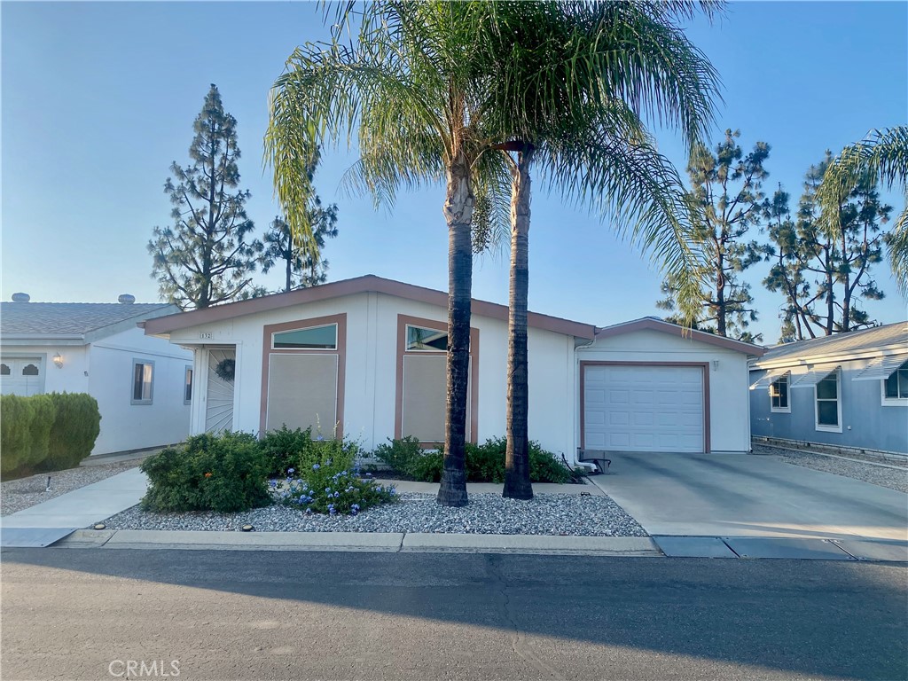 Are you looking for a home with resort living, affordability and in excellent condition? This is it! Come and visit beautiful "Foothills of Hemet". This senior community is well taken care of. As you drive up to a gated community you will see the pride of this community. Driving through this lovely neighborhood is a pleasure. As you arrive at #132 you will find a home with great curb appeal. Enter your home and you will find a spacious open floor plan. Large living room, dining room and exceptionaly clean kitchen. Walk down the hall to a huge primary bedroom, walk in closet and private bath. There is also a main bath, and a second bedroom all in immaculate condition. Plenty of windows and skylights give this home an open cheerful feeling. This home has been well taken care of inside and out. There is a separate laundry room and an attached garage. Added bonus is a long driveway. Aside from this home being in an excellent area, excellent condition and excellent floor plan, it also has many expensive upgrades. In 2020 a 30 year roof with architectural shingles and UV protection was installed. Exterior privacy screens, gutter filters, water heater and numerous piers added to qualify the home for earthquake insurance. Moisture barriers were added both under carriage and around the exterior. Many more upgrades and improvements throughout the home plus plantation shutters. Refrigerator, washer and dryer included. Step out to a spacious back yard and see a beautiful view of the mountains and on the side you will be able to see the sunset. Relax in the covered patio. This home is low maintenance inside and out. Take a short walk to the pool area and guest parking. This community offers 2 swimming pools,2 spas, club house and pickle ball courts. If you are looking for a great retirement home, this one is it.