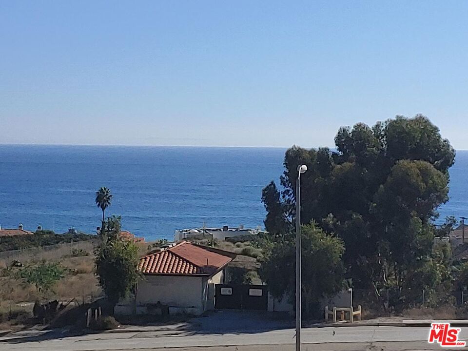 Available Now! Partially FURNISHED or Unfurnished, enjoy incredible ocean views from this lovely, updated townhome. Experience a luxurious lifestyle in Central Malibu, walking distance to Pepperdine, shopping at the new Whole Foods, Lumber Yard, Farmer's Market, Malibu Country Mart, take a stroll on Malibu Pier, World class surfing, dog park and the beach! Open floor plan, lots of natural light, great indoor / outdoor living, large living room with fireplace, chef's granite kitchen, professional appliances, breakfast nook, big ocean view deck and large ground patio yard with ocean views! Large primary suite has walk-in closet and marble master bath. Both primary suite and guest bedroom are on the bottom floor, with ocean views, and have a covered, large patio yard. Move-in ready, newer bamboo & wood floors throughout! Light and airy floor plan. Private laundry inside unit. Community amenities include Olympic size heated pool, spa, two saunas, changing rooms, BBQ, and more. Covered parking with storage. Amenities include salt water Olympic size pool, large jacuzzi, two separate saunas, showers and changing rooms. Close to Pepperdine University, Location! Location! - Nothing else compares at this price! Grab it quick before it's gone! If you're looking for a retreat with modern conveniences and an unbeatable location with panoramic views of the ocean, welcome home!