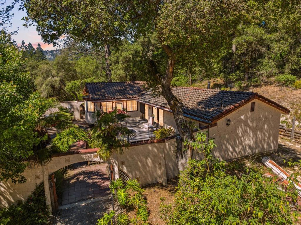 Nestled on a flat, sunny lot, this charming 3-bedroom, 2-bathroom home offers everything you need and even has horse property potential! Enjoy the perfect balance of convenience and privacy, located just minutes from town with its array of delicious restaurants, grocery stores, and access to world-class hiking and mountain biking trails. The spacious kitchen is a dream for any home chef, featuring beautiful countertops, a large pantry, and stainless steel appliances. In the cooler months, relax by the wood-burning fireplace with a favorite book and hot drink. With plenty of room for gardening, a chicken coop, and a private well, this property is ready to bring your homesteading visions to life.
