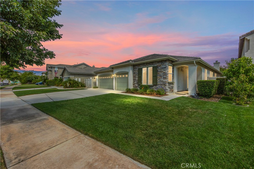 This Hard To Find, Expansive Single Story home shows true pride of ownership and SHOWS BETTER THAN A MODEL HOME WITH TONS OF UPGRADES. This home truly has it all and offers lots of living space to spread out and enjoy this North Redlands gem of a neighborhood. The house has a paid off solar panel system, fully landscaped front and back yards with new vinyl fencing and an aluminum covered patio to enjoy the back yard garden and fruit trees. The home has a 3 car, side by side garage, with aluminum doors and openers that is a great upgrade to have for covered parking and storage needs. Inside there are plantation shutters, wood flooring throughout, custom built in cabinetry, ceiling fans, A NEW CENTRAL AIR & HEATING SYSTEM, quartz countertops in the kitchen, walk in closet in spacious master bedroom that has a retreat area as well. The floor plan is open, great for entertaining and is light and bright with lots of dual pane windows and neutral color paint scheme inside. If you are tired of walking up and down stairs and have been waiting for that modern, luxurious, large, one level home that has space for a growing family, but still is cozy enough to use far into ones retirement years, then this is the perfect house to consider. Location is excellent! It is walking distance to Citrus Valley High School, Israel Beal 13 acre plus city park with walking trails, multiple playgrounds, picnic/BBQ areas and sports fields. The house is close to all the shopping, restaurants and entertainment areas in downtown Redlands & Citrus Plaza; plus it has easy access to the 10 and 210 freeways. Lastly, the home has low taxes around 1.25%. Don't miss this one, come and see this home before someone else makes it theirs.