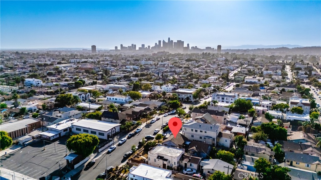 A Rare Opportunity in the Heart of Boyle Heights!
Situated at the top of the street with sweeping views of the downtown skyline, this LAR2-zoned property offers tremendous potential. Spanning a generous 5,851 sq. ft. lot (approx. 45 ft x 130 ft), it presents the perfect opportunity to build two large duplexes and potentially add two ADUs at the rear (buyer to verify), or to buy, update and owner occupy at a tremendous discount. Currently, the property includes two detached tenant-occupied units that will remain occupied. With new development booming throughout Boyle Heights, this centrally located property is a true gem—just minutes from Downtown LA, major freeways, shops, and restaurants. Opportunities like this are rare—don’t miss your chance to invest in one of LA’s fastest-growing neighborhoods!