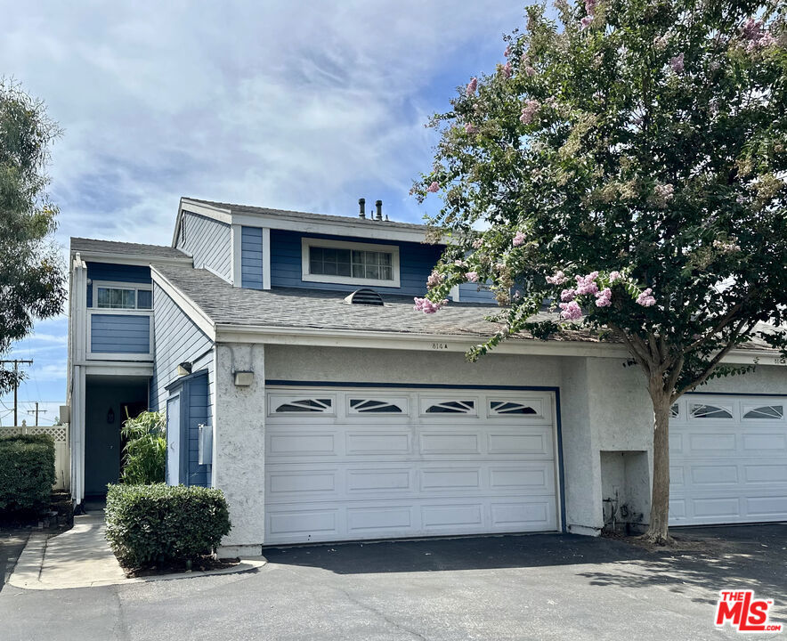 Amazing End-Unit Townhome with possibly the Largest Yard in the community. Most units in Nantucket Village only have an outdoor patio, but this unit has both. With only 1 attached wall, it feels like a house. The high ceilings and open floor plan provide lots of natural light. Upstairs you'll find the main bedroom with ensuite bath, a loft, and a balcony with storage closet. The loft is large enough to be used as a 3rd bedroom, office or gym. The 2nd bedroom and bath are downstairs. There are walk-in closets in both bedrooms, central air & heat, a fireplace in the living room, laundry in the 2-car garage, and it comes with a permit for a 3rd parking space. Nantucket Village is a gated community with a pool, spa, and green space perfect for picnics. HOA includes water & trash.