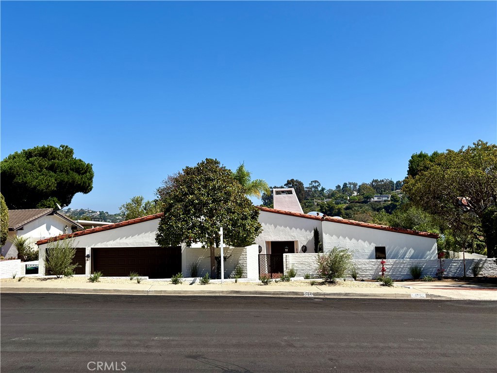 California Single-Level Hacienda – On El Niguel Golf Course
3 Bedrooms + Optional 4th Bedroom/Den | 3 Bathrooms | 3-Car Garage | Pool
Rare opportunity to own a sprawling Spanish-style single-level estate tucked away on a cul-de-sac along the prestigious El Niguel Country Club Golf Course.
Inside, the expansive living room impresses with soaring wood-beamed ceilings, a dramatic brick fireplace wall, and wall-to-wall windows framing captivating golf course and pool views. The formal dining room and full wet bar flow seamlessly into the family room with a second fireplace and French doors opening to a raised patio for outdoor dining.
The chef’s kitchen offers dual islands, abundant counter space, Spanish tile finishes, and an oversized in-kitchen dining area. A spacious laundry/utility room with skylights, storage, and an additional refrigerator adds convenience. An adjoining bonus room provides flexibility as an office, library, or optional 4th bedroom.
The primary suite enjoys pool and golf course views, private patio access, dual walk-in closets, and a spa-like bath with hand-painted tiles, sunken tub, and open shower. Each additional bedroom features its own en-suite bath and walk-in closet.
Outdoors, multiple patios, lush landscaping, and a sparkling pool embrace the stunning golf course setting—steps away from the 11th tee box and 10th hole.