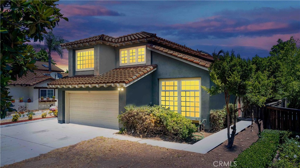 Beautifully upgraded 3BD/2.5BA home in a desirable Corona neighborhood! This spacious approx. 1,700 sq ft residence features a light-filled open floor plan with gleaming laminate flooring, custom lighting, and designer finishes throughout. The chef’s kitchen boasts quartz countertops, stainless steel appliances, and shaker cabinetry—perfect for entertaining. The family room flows seamlessly into the kitchen and offers a cozy yet modern vibe with . Upstairs, the expansive primary suite includes a walk-in closet and a spa-like bath with dual vanities. Step outside to a landscaped backyard with a covered patio ideal for dining or relaxing. Located near top-rated schools, parks, shopping, dining, and easy freeway access. Turnkey and move-in ready—this is California living at its best!