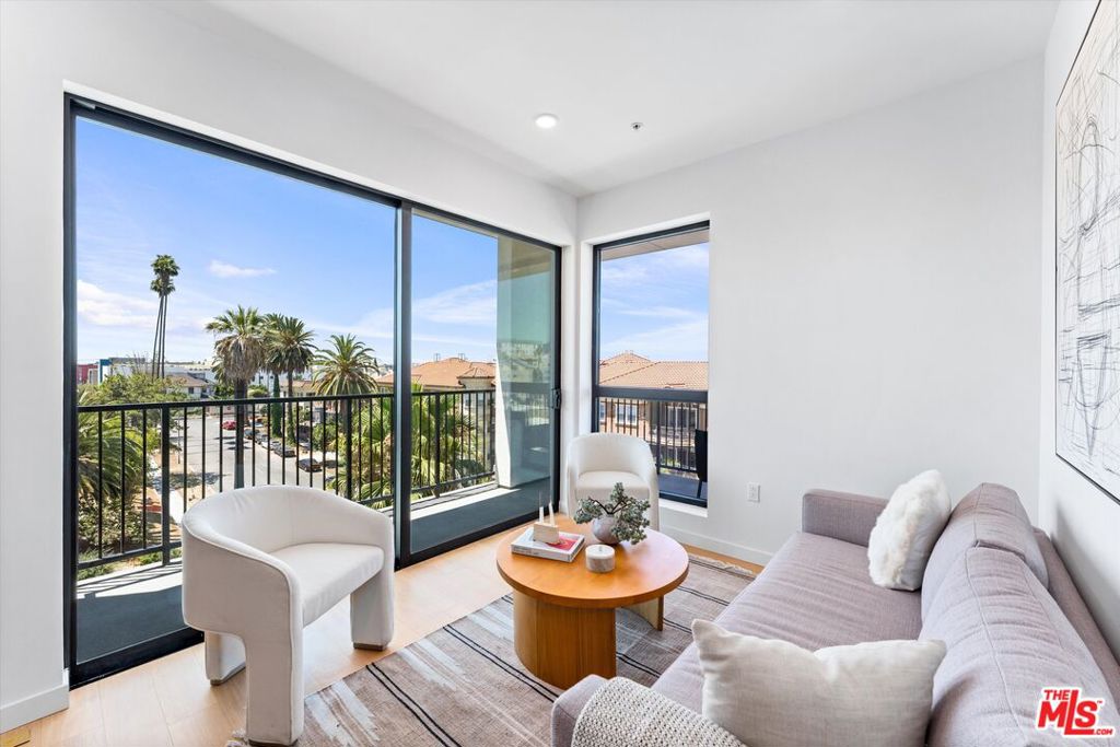 Corner one-bedroom residence with a beautiful wraparound balcony in Mosaika, a brand-new condominium community that blends contemporary sophistication with thoughtful functionality in one of Los Angeles' most vibrant and walkable neighborhoods. This light-filled home features an expansive open layout, floor-to-ceiling windows, concrete floor, and hand-selected designer finishes. The kitchen boasts custom cabinetry and premium appliances, while the spa-inspired bathroom includes a sleek vanity and elegant tile details. Enjoy an oversized balcony perfect for relaxing or entertaining. Residents of Mosaika enjoy boutique-style amenities, including a fitness center and a rooftop sky lounge with BBQ area, lounge seating, and panoramic city views. Mosaika where style meets substance and location meets lifestyle offers an exclusive living experience in the heart of Los Angeles.