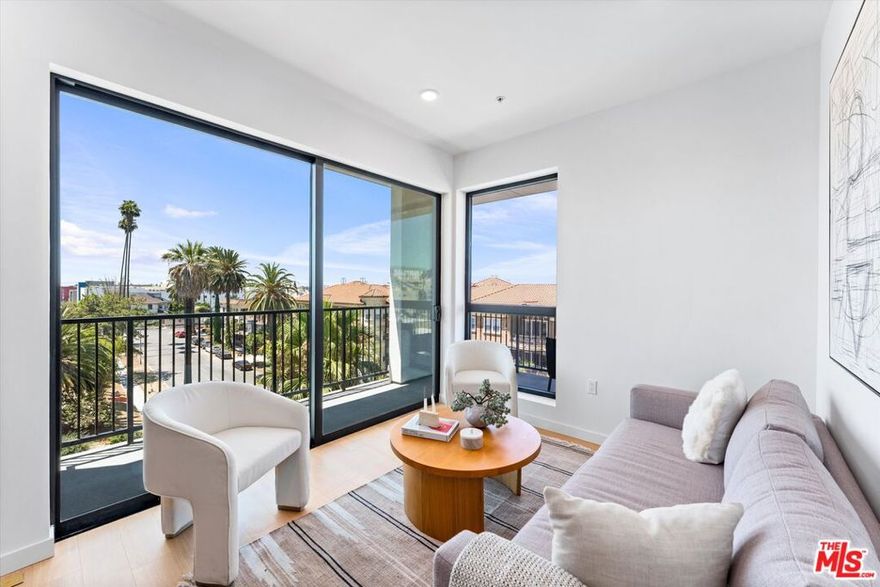 Corner one-bedroom residence with a beautiful wraparound balcony in Mosaika, a brand-new condominium community that blends contemporary sophistication with thoughtful functionality in one of Los Angeles' most vibrant and walkable neighborhoods. This light-filled home features an expansive open layout, floor-to-ceiling windows, concrete floor, and hand-selected designer finishes. The kitchen boasts custom cabinetry and premium appliances, while the spa-inspired bathroom includes a sleek vanity and elegant tile details. Enjoy an oversized balcony perfect for relaxing or entertaining. Residents of Mosaika enjoy boutique-style amenities, including a fitness center and a rooftop sky lounge with BBQ area, lounge seating, and panoramic city views. Mosaika where style meets substance and location meets lifestyle offers an exclusive living experience in the heart of Los Angeles.