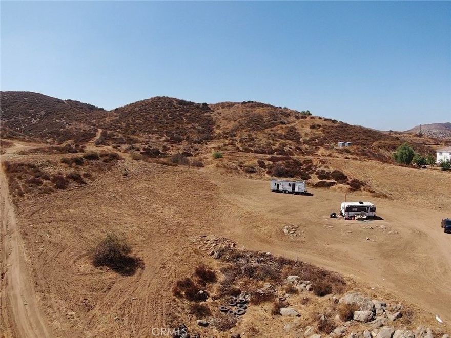 Great investment  opportunity.!  5.05 acres next to big Custom home, many possibilities.! There is an Electrical pole close to the property, Buyer is advise to investigate the proximity of Utilities.