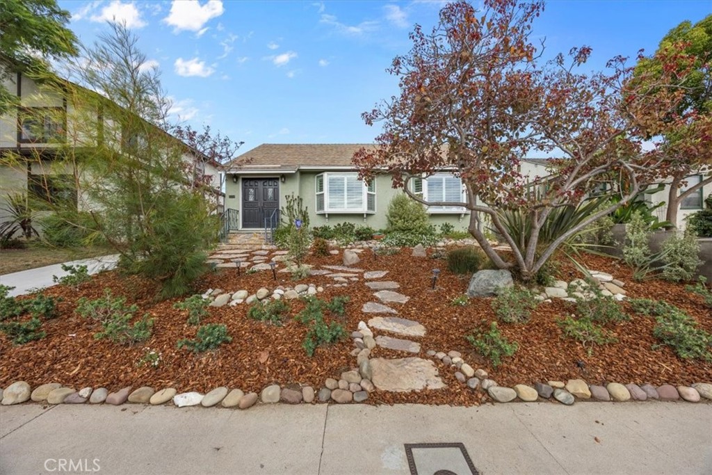 Welcome to wonderful Westchester, a hidden gem of a small town within a big city. Pockets of friendly neighborhoods and a strong sense of community make this property a must see on your house search. Tucked within one of the most inviting areas is a recently renovated home settled on a tree-lined street with quaint vintage lamp posts. The fresh lush landscaping, and a meandering path of steppingstones, exude peaceful curb appeal that beckons you inside.
There are many outstanding aspects to this home—as you step through the decorative front doors, the first feature you notice is the appealing open-concept floor plan. Glistening sunlight filters through the bay windows, showcasing striking white oak natural hardwood floors that provide the perfect foundation. A custom-built-in entertainment center offering a plethora of storage is the elegant focal point and the core of the living area.
Lovingly transformed in 2023, the heart of the home is a superb kitchen with timeless design and top-grade appliances to delight any culinary enthusiast. An expansive center island underneath stylish designer pendant lighting is surrounded by custom cabinetry with soft-close doors and drawers, an accessible pantry, and gorgeous white quartz countertops.
The spacious primary suite features mesmerizing beamed ceilings, a cozy fireplace, and walk-in closet. Indulge in a luxurious en-suite bathroom including a soaking tub, dual vanities, and walk-in shower with dual shower heads that create a spa-like experience.
For the comfort and convenience of family or guests, there are two lovely bedrooms and a refreshingly refined bathroom. Additional amenities include a dedicated laundry area and 2-car garage with epoxy flooring.
Stylish clear glass doors effortlessly lead you to your own private backyard oasis providing a sense of ultimate tranquility and optimal entertainment. The backyard was thoughtfully redesigned with an abundance of lush foliage, new turf, custom pergola, and modern concrete tiles. This outdoor retreat is ideal for daily relaxation or hosting lively gatherings. This is truly the appreciation of Southern California outdoor living.
This highly sought-after neighborhood is close to trendy dining, shopping, schools, and scenic beaches. Love Where You Live...