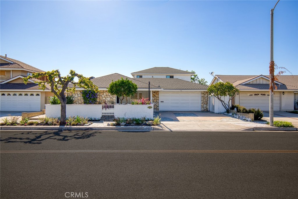 Experience elevated coastal living in this beautifully upgraded 4-bedroom, 3-bathroom residence, offering 2,942 square feet of thoughtfully designed space on a 6,000-square-foot lot in one of Huntington Beach’s most sought-after neighborhoods. Step into a light-filled open floor plan where spacious living and dining areas flow seamlessly, anchored by a gourmet kitchen featuring premium appliances, custom cabinetry, and generous counter space—perfect for both entertaining and everyday comfort. The primary suite offers a private retreat with a spa-inspired bathroom and a large walk-in closet. Three additional bedrooms provide flexibility for family, guests, or a dedicated home office. All three bathrooms are tastefully updated with modern fixtures and finishes. Outside, the backyard has been transformed into a vibrant garden oasis. Instead of traditional lawn, you'll find a curated landscape of colorful flowers and mature plantings that create a serene, low-maintenance setting ideal for outdoor gatherings or quiet relaxation. Located minutes from top-rated schools, shopping, dining, and the beach, this home blends luxury, lifestyle, and location. Schedule your private showing today and discover the charm of 16401 Serenade Lane.