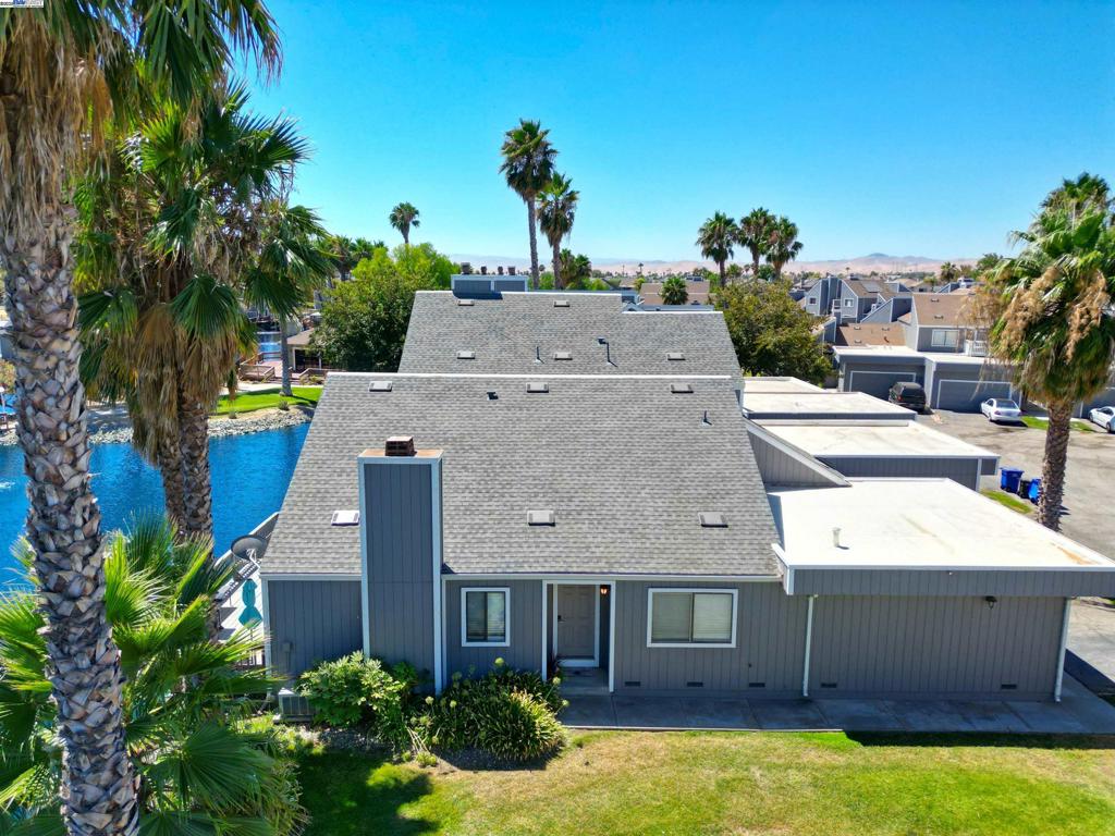 Peaceful and spacious 2 bedroom unit with a 2 car garage. Manufactured hardwood floors throughout. Great setting on a lagoon and close to the Marina. All electric appliances and a gas fireplace.