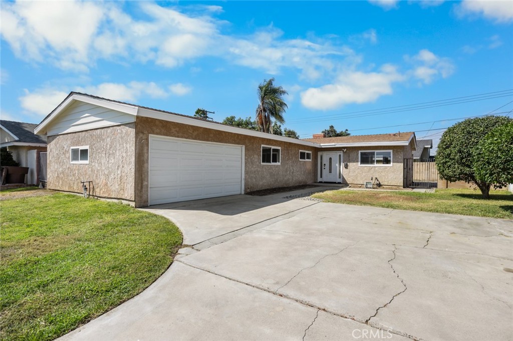 Opportunity Knocks!! Excellent starter home located in West Anaheim. Outstanding features include: Remodeled kitchen that includes newer cabinets, granite counter tops, Stainless steel sink, built-in microwave, other features include double pane windows, 6 panel doors, wood and gas burning fireplace, ceiling fans in all bedrooms, central air conditioning, copper plumbing, block wall on all 3 sides of property, washer/dryer hook ups in garage, garage access, concrete driveway, ample space available for rv/boat storage, also with some modification home could serve as a 4 bedroom, or 3 bedroom home with 4th bedroom area serving as an office, den, formal dinning area, lots of flexibility, interior of property along with most of exterior wood work has been freshly painted. Do not miss out on this great home show today!!!