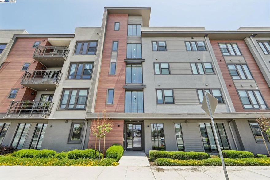 Experience California living in this beautifully designed single-story luxury condo. With an open layout and abundant natural light, this modern home features a chef’s kitchen with ceiling-height custom cabinetry, quartz island, and built-in stainless steel appliances. The spacious primary suite includes a large walk-in closet and a sleek bathroom with dual vanities and a glass-enclosed shower. Additional highlights include owned solar panels, a 2-car tandem garage with an EV charging outlet, and extra storage space. Located in the highly desirable Innovation community, residents enjoy access to a clubhouse, BBQ area, fitness center, and swimming pool. Conveniently close to parks, top schools, grocery stores, restaurants, and within walking distance to BART—this move-in-ready home blends comfort, efficiency, and location.