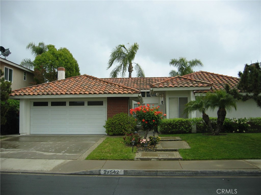 Single level in prime location - close to Lake Mission Viejo. Excellent 4 bedroom floor plan. Kitchen has been updated & has Corian countertops. Bosch gas range & microwave + trash compactor, stainless steel sink, pull out drawers cabinetry. Vinyl windows and sliders with custom plantation shutters.
Engineered wood flooring in master bedroom and 4th bedroom. Tile flooring in living room & family room. Fireplace in family room. Ceiling fans throughout.
Nice sized private rear yard.