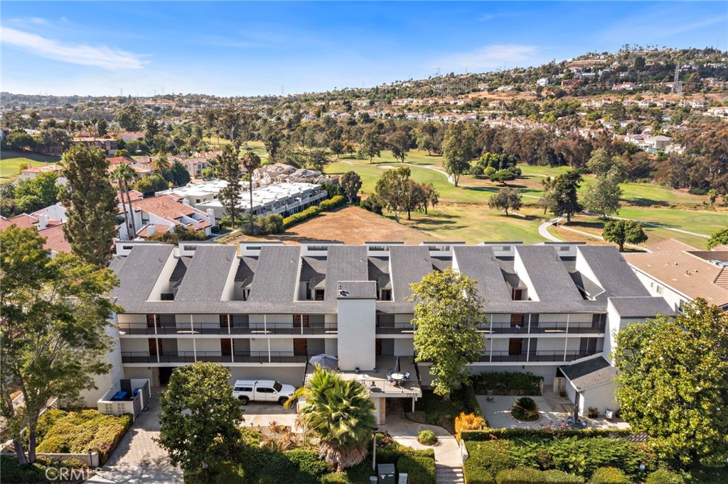Dive into the charm of this just-listed gem overlooking the golf course! With a single level floor plan, spacious private front courtyard, two scenic back patios, and fresh interior paint, this home is an absolute delight. Located on an upper level in this quaint community, it's your gateway to adventure with easy access to Omni La Costa Resort and Spa, stunning beaches, hip eateries, and a multitude of bike and hike trails. Inside, enjoy an open-concept floor plan with a large great room, galley style kitchen with a breakfast counter, 2 large bedrooms, and convenient inside laundry. The property provides a blank canvas to create your perfect coastal-close retreat, perfect for a second home, full time residence, investment property or possible flip. Priced ~ $100k below last sale and located in a small charming community featuring gated underground parking garage with two designated parking spaces, building elevator, large common area deck for relaxing and unplugging and community laundry room for your added convenience. The building was recently painted and gate doors and handrails replaced. HOA covers trash and water.