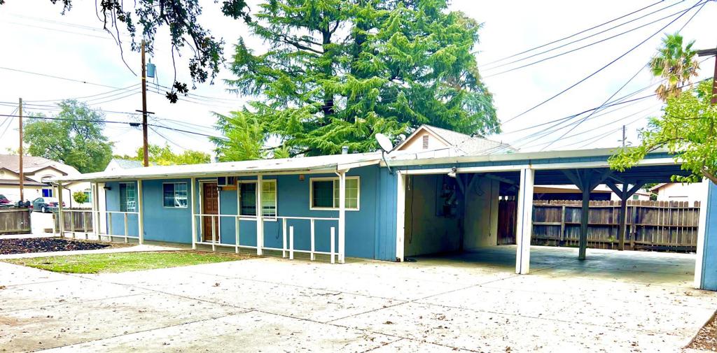 Calling All Buyers, First time homebuyers, Investors and Developers!!! Opportunity awaits you!! Unit B recently vacant and ready for owner to move in. Almost 14,000 sq ft and zoned for up to 6 units. Current structure is a duplex with readily convertible carport to make it a triplex. Back secure lot is almost 10,000 sq ft of concrete slab 6" thick rebar reinforced and ready for new buildings to be built, or continue renting it as a storage lot. Need a secure storage lot for your equipment instead?? Rent the duplex to cover mortgage and have access to almost 10,000 feet of fenced secure storage for heavy equipment or anything else you have. With so many opportunities to make money here you don't want to let this one slip by. Seller offering up to $10,000 buyer credit toward closing costs