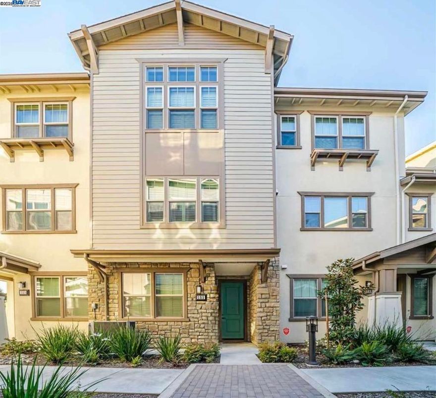 Wow! This stunning townhome features a prime interior location and exceptional designer finishes throughout. The gourmet kitchen impresses with quartz countertops, Sienna shaker cabinets, a stylish tile backsplash, Bosch appliances, a spacious island, and a walk-in pantry. The sun-filled great room offers plantation shutters and hardwood floors, creating a warm and elegant space for relaxing or entertaining.  Upstairs, the luxurious primary suite boasts rare 12-foot ceilings, a large walk-in closet, and a spa-inspired bath with dual vanities and Venetian marble counters. A private downstairs suite adds flexibility for guests, an office, or multigenerational living.  Additional perks include upstairs laundry, upgraded carpeting, hardwood floors, and plantation shutters throughout. Ideally located near Central Park, downtown, 680/880, Tesla, BASIS School, and BART—this home delivers outstanding value in an unbeatable location!