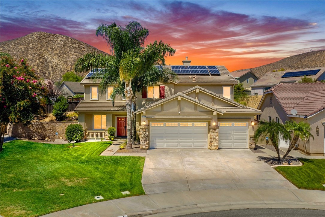 You’ve found your unicorn! This stunning turnkey 3,581 sq. ft. home in the Newport Hills community offers 4 bedrooms plus a flex office/5th bedroom and 3 full bathrooms with OWNED solar. Sitting on a rare 12,196 sq. ft. corner lot at the end of a cul-de-sac, the property boasts a large grass front yard, oversized side yard, entertainer’s deck, sparkling pebble-tech pool with waterfall and spa, and an additional gated side yard with a custom fence for pool equipment. Enter through the quaint patio and welcoming red double doors to find a formal dining room and a double-door office/flex space, perfect for a 5th bedroom if desired. The gourmet kitchen showcases beautiful granite counters, custom tile backsplash, soft-close drawers, under-cabinet lighting, walk-in pantry, and a stunning detailed stove hood, opening to the spacious family room with fireplace and built-in entertainment center. The first floor also includes a full bedroom and bath with outdoor access, plus a laundry/mudroom with utility sink off the 3-car garage with 220V EV charger. Upstairs, enjoy a large loft, two spacious secondary bedrooms with walk-in closets, and an upgraded bath with dual sinks and granite counters. The private primary suite is complete with a retreat and two-way fireplace, his-and-her walk-in closets, spa-inspired ensuite with dual sinks, clawfoot tub, standalone shower, and shiplap accents, plus a private deck to take in the sunset views. The entertainer’s backyard features a covered patio with stamped concrete, pool and spa, deck space, large grassy side yard, plum tree, outdoor speakers, and string lighting for the perfect ambiance. Additional features include plantation shutters, Nest thermostat, LVP flooring, newer carpet, recessed lighting, ceiling fans in all bedrooms, and ample storage including a large wraparound closet under the stairs. All of this just minutes to shopping, dining, and conveniences!
