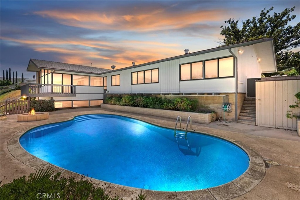 *Canyon Crest Country Club* "Designed in 1968 by esteemed Riverside architect Clinton Marr, the ‘ Dr. Bowker Residence’ at 1145 Via Vallarta embodies refined mid-century modernism infused with Japanese-inspired spatial harmony. The post-and-beam structure with sliding glass walls opens to golf-course and mountain views. Inside, built-ins, lush wood detailing, and an integrated indoor/outdoor plan create a serene luxury. This architectural gem forms part of Riverside’s significant mid-century legacy, deeply rooted in the visionary work of Clinton Marr. Meticulously maintained for decades by the original owner. Recently updated with modern finishes, fantastic floorplan that is perfect for entertaining and soaking up views of the pool, country club, downtown skyline, and mountains in the distance. Rare combination of 5 large bedrooms and 4 bathrooms all on one level with an oversized game room and restroom (could become ideal space for ADU with direct access to side yard) on the lower level with direct access to the pool. Must see in person to apricate the details of this 1968 classic.