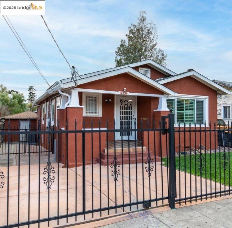 Welcome to 8039 Idlewood Street, a charming single story home located in Oakland’s Eastmont neighborhood. Built in 1925, this home showcases classic character with a welcoming front porch, hardwood floors and a cozy fireplace. Upgrades include new dual-pane windows, solar system, smart features, a new HVAC heating and cooling system and a new water heater. The exterior features a long driveway with ample parking, a converted garage serving a variety of needs, and a versatile storage unit in the backyard—ideal for tools, hobbies, or additional storage needs. With convenient access to the 580 freeway and nearby shopping, this home combines comfort with accessibility. Bring your vision and make this house your home!