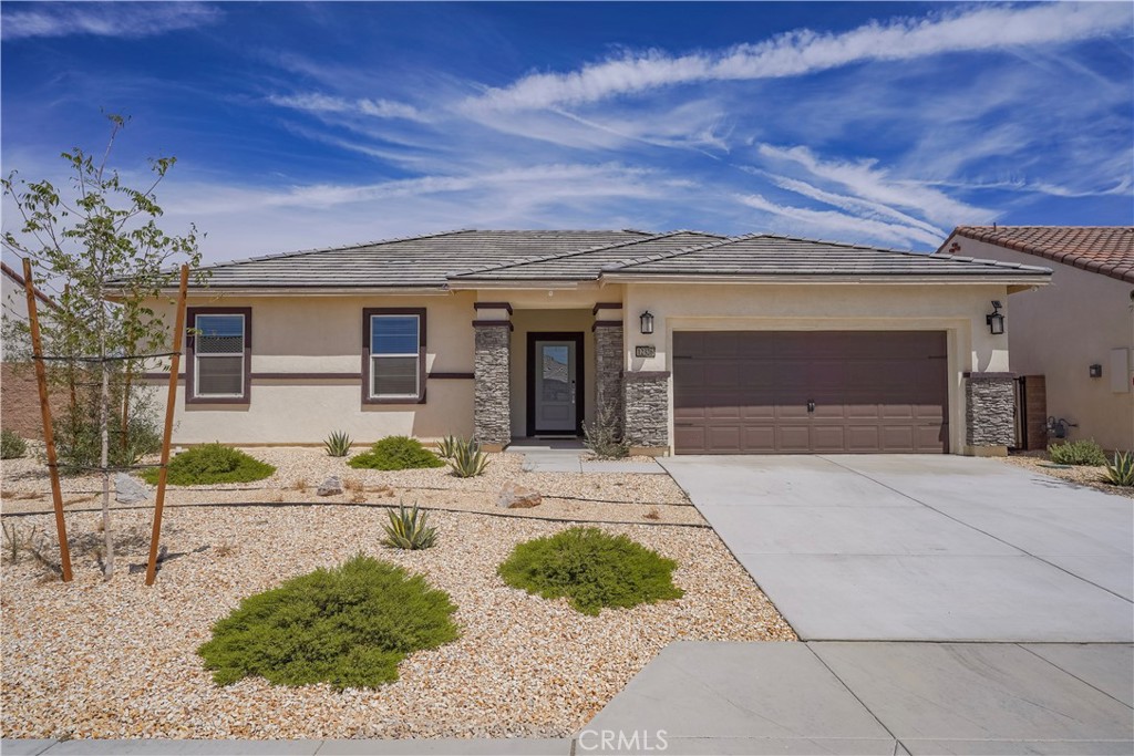 Welcome to this 2023-built home featuring 3 bedrooms and 2 bathrooms. Step inside to an inviting open floor plan with a spacious kitchen that boasts a center island, granite counters, and pantry. The home offers a mix of carpet and vinyl flooring, a convenient indoor laundry room, and a 2-car garage. Enjoy the benefits of paid-off solar, a landscaped front yard, and a private backyard with a covered patio—perfect for relaxing or entertaining. This move-in ready home blends modern style with energy efficiency and everyday comfort. Schedule your tour today!